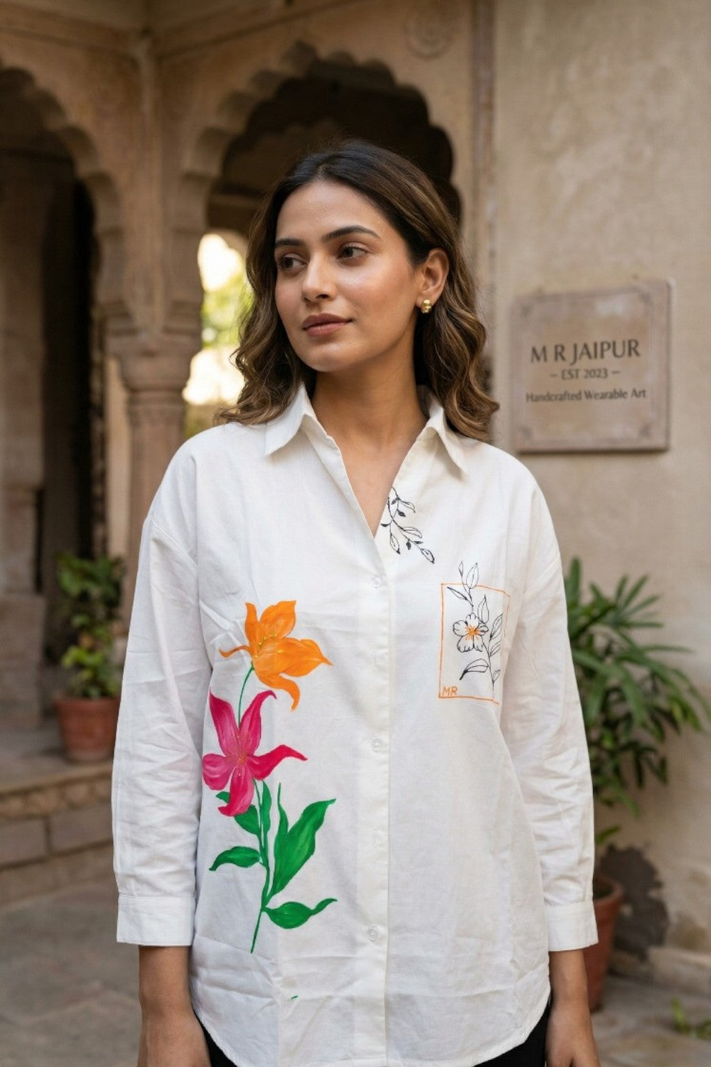 women wearing THE AMARIS HANDBLOCK SHIRT, a floral inspired hand-painted cotton satin shirt from M R JAIPUR