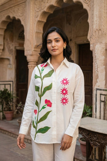 women wearing THE AMER VINE HANDBLOCK SHIRT, a floral inspired hand-painted cotton satin shirt from M R JAIPUR