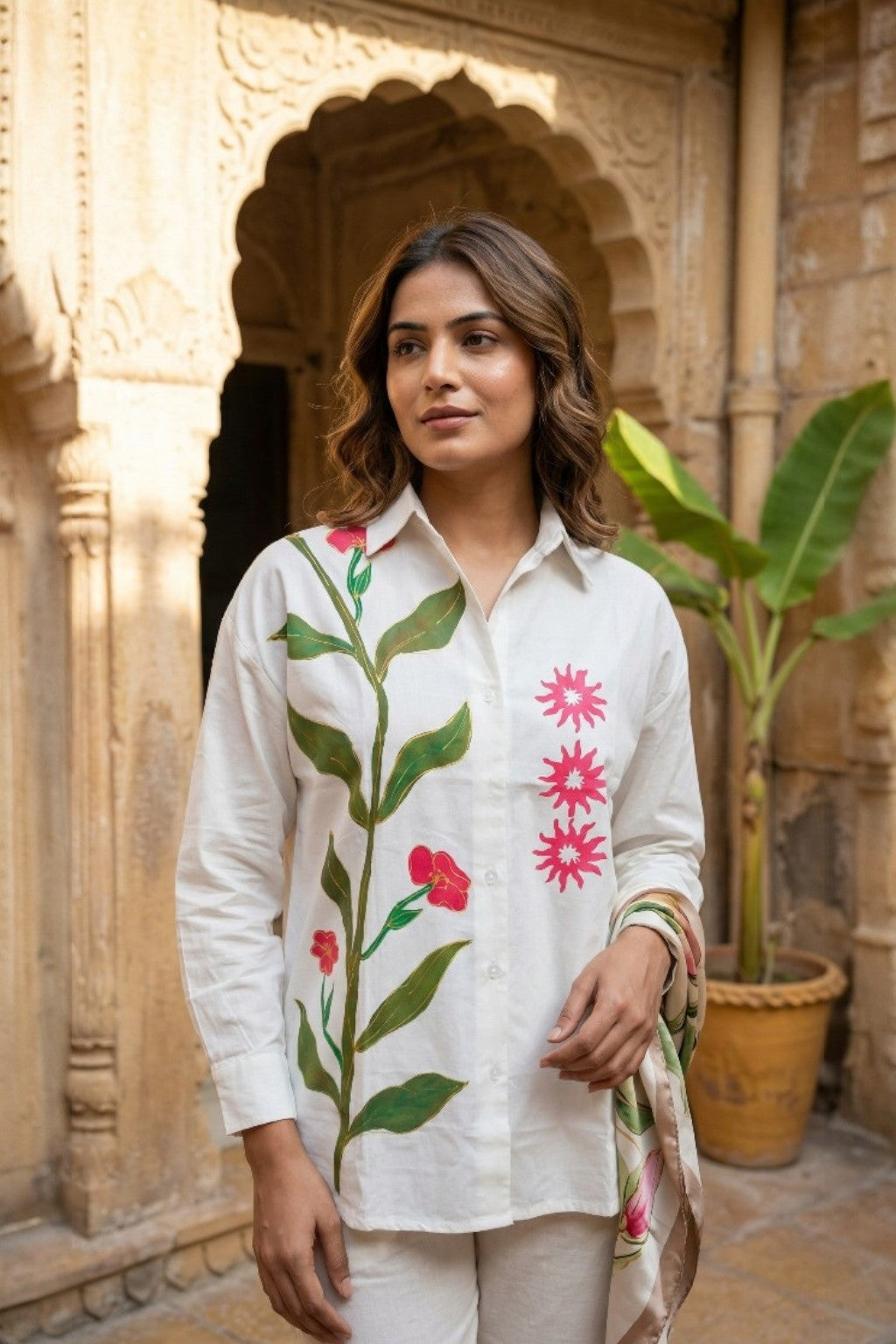 women wearing THE AMER VINE HANDBLOCK SHIRT, a floral inspired hand-painted cotton satin shirt from M R JAIPUR
