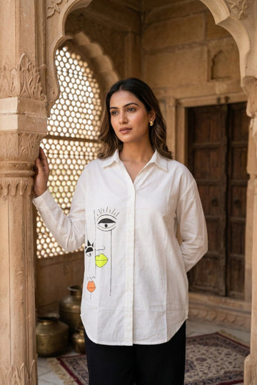 women wearing THE VIRAASAT HANDPAINTED SHIRT, a tribal inspired hand-painted cotton satin shirt from M R JAIPUR