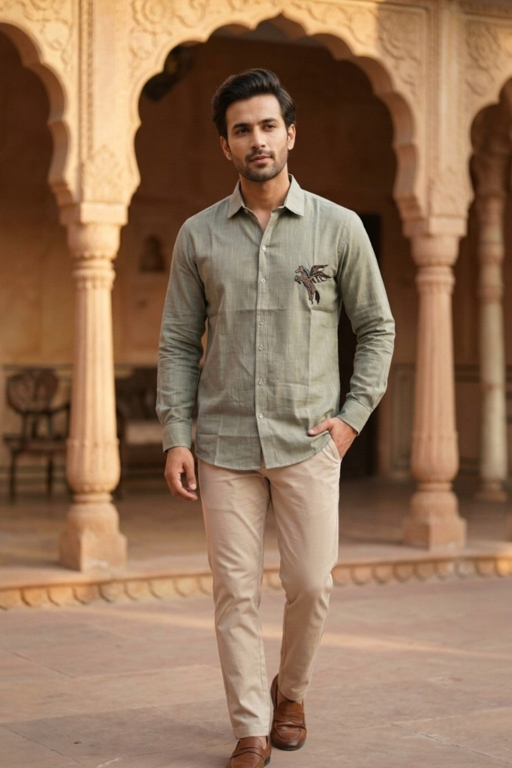 Man wearing PEGASUS MENS SHIRT, a pegasus hand-embroidered cotton-linen shirt from M R JAIPUR