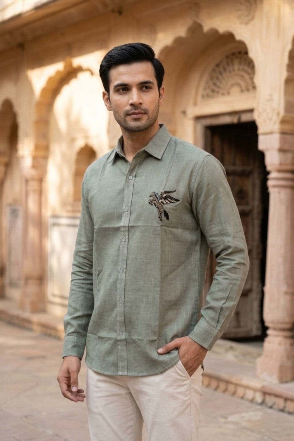 Man wearing PEGASUS MENS SHIRT, a pegasus hand-embroidered cotton-linen shirt from M R JAIPUR