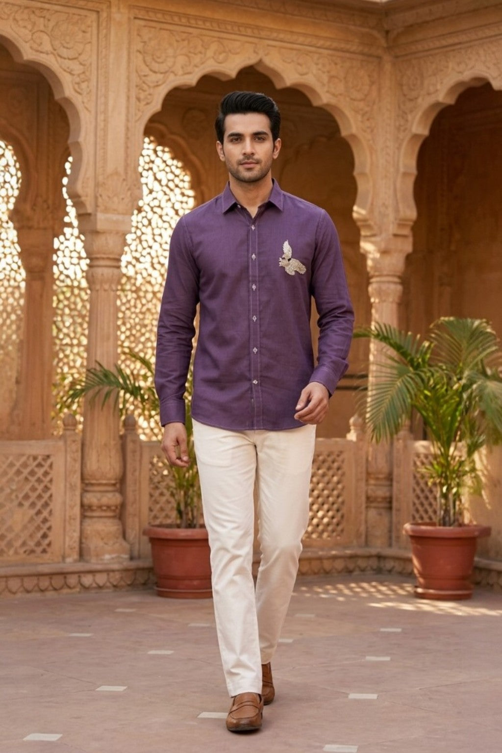 Man wearing AVIAN MENS SHIRT, a purple hand-embroidered cotton-linen shirt from M R JAIPUR