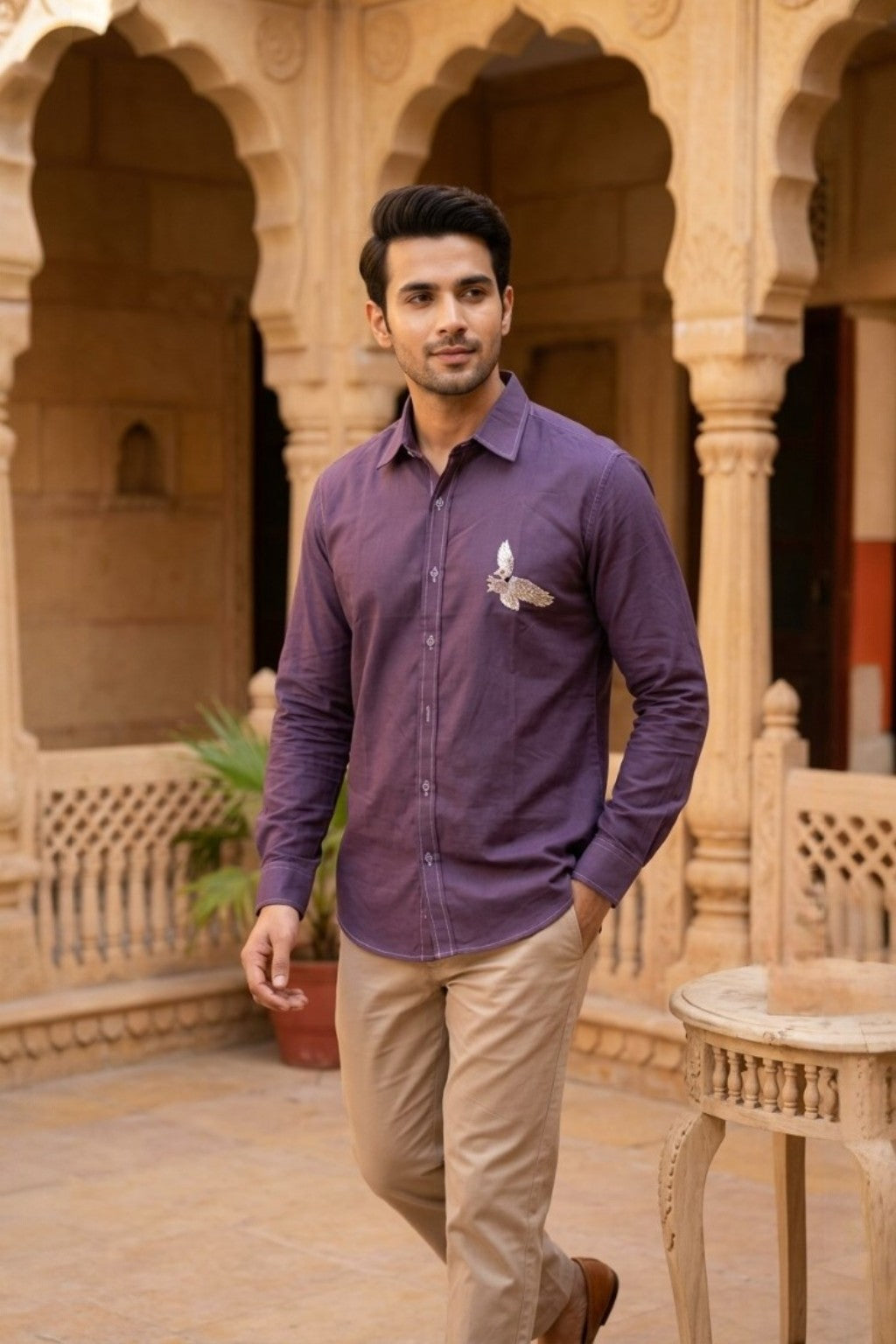 Man wearing AVIAN MENS SHIRT, a purple hand-embroidered cotton-linen shirt from M R JAIPUR