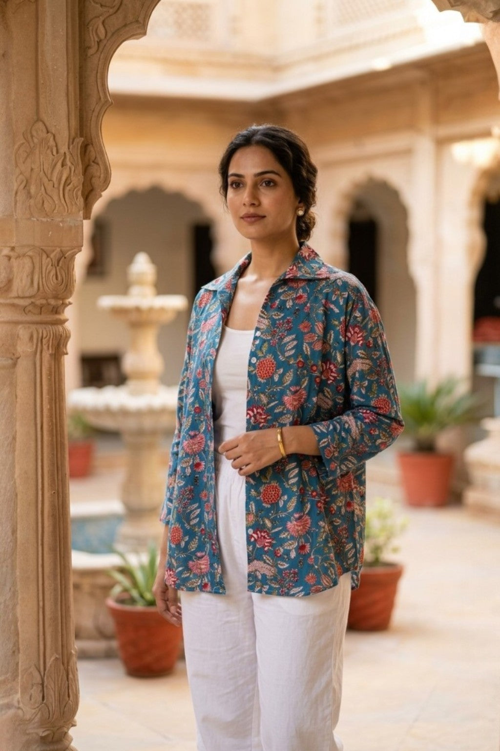 women wearing THE NEELBAGH HANDBLOCK SHIRT, a floral inspired hand-block cotton shirt from M R JAIPUR