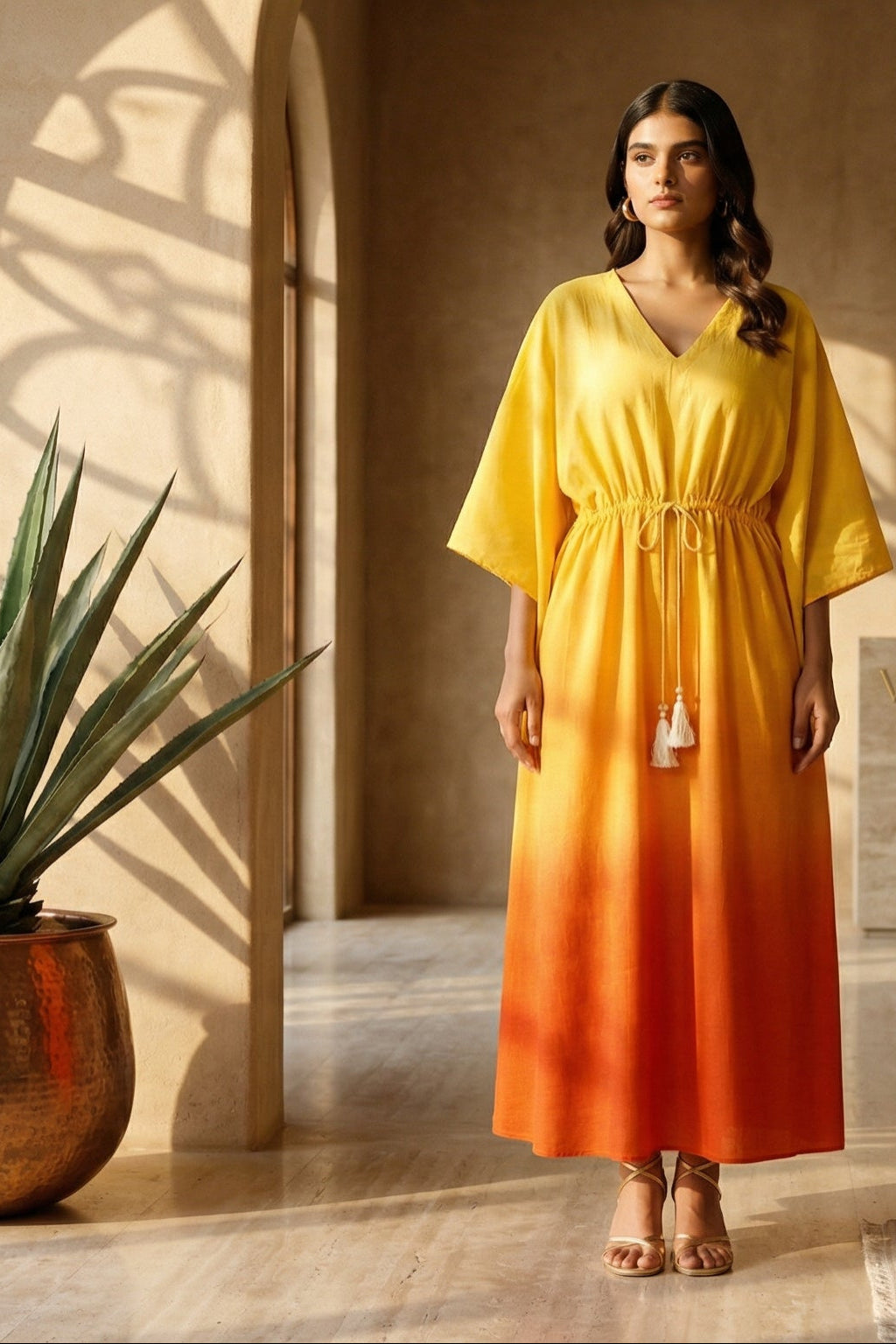 women wearing KAFTAN, a yellow hand-dyed premium 100% Viscose/Silk Blend kaftan from M R JAIPUR