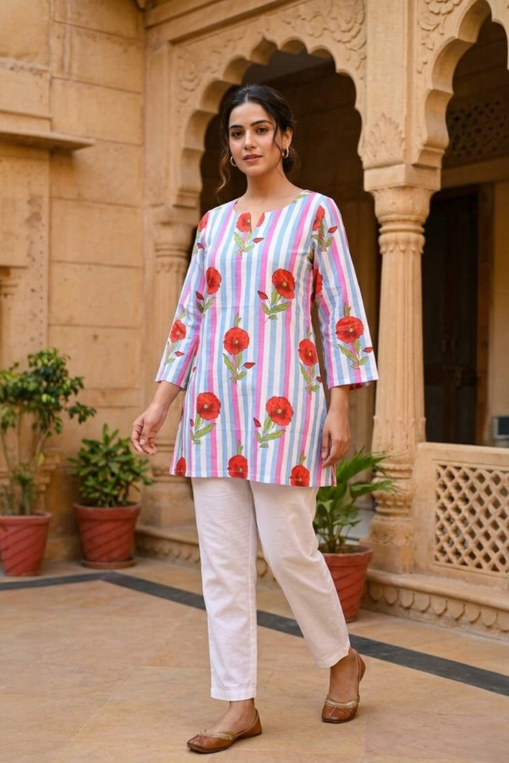 women wearing THE SAWAI RED BLOOM HANDBLOCK KURTI, a red bloom inspired hand-block cotton kurti from M R JAIPUR