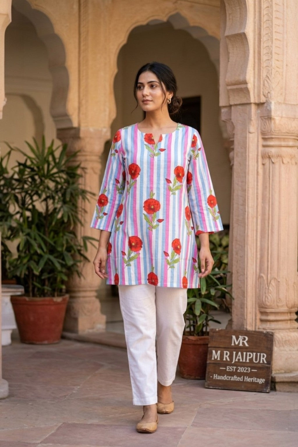 women wearing THE SAWAI RED BLOOM HANDBLOCK KURTI, a red bloom inspired hand-block cotton kurti from M R JAIPUR