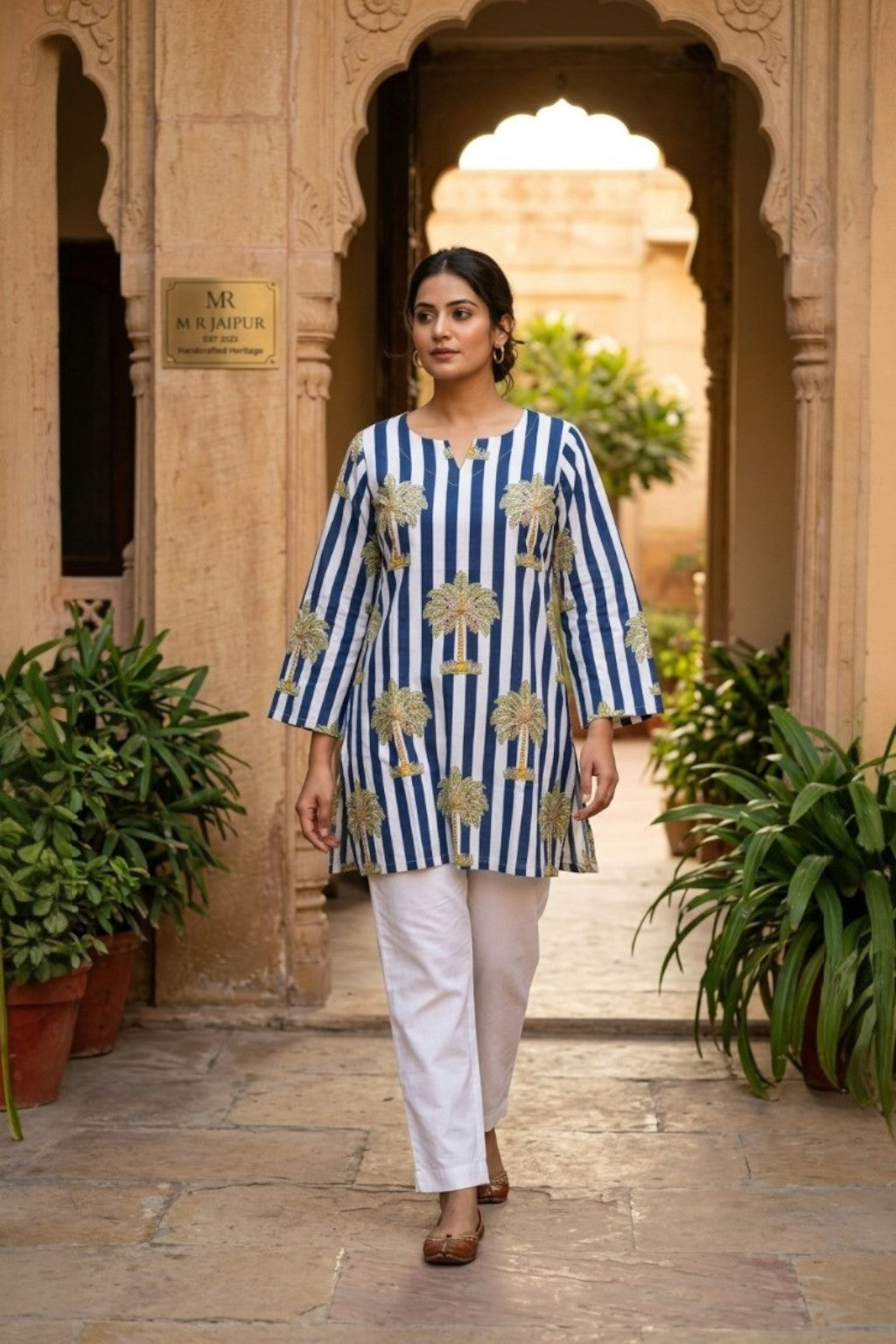 women wearing THE JAL BUTTI HANDBLOCK KURTI, a blue stripes inspired hand-block cotton kurti from M R JAIPUR